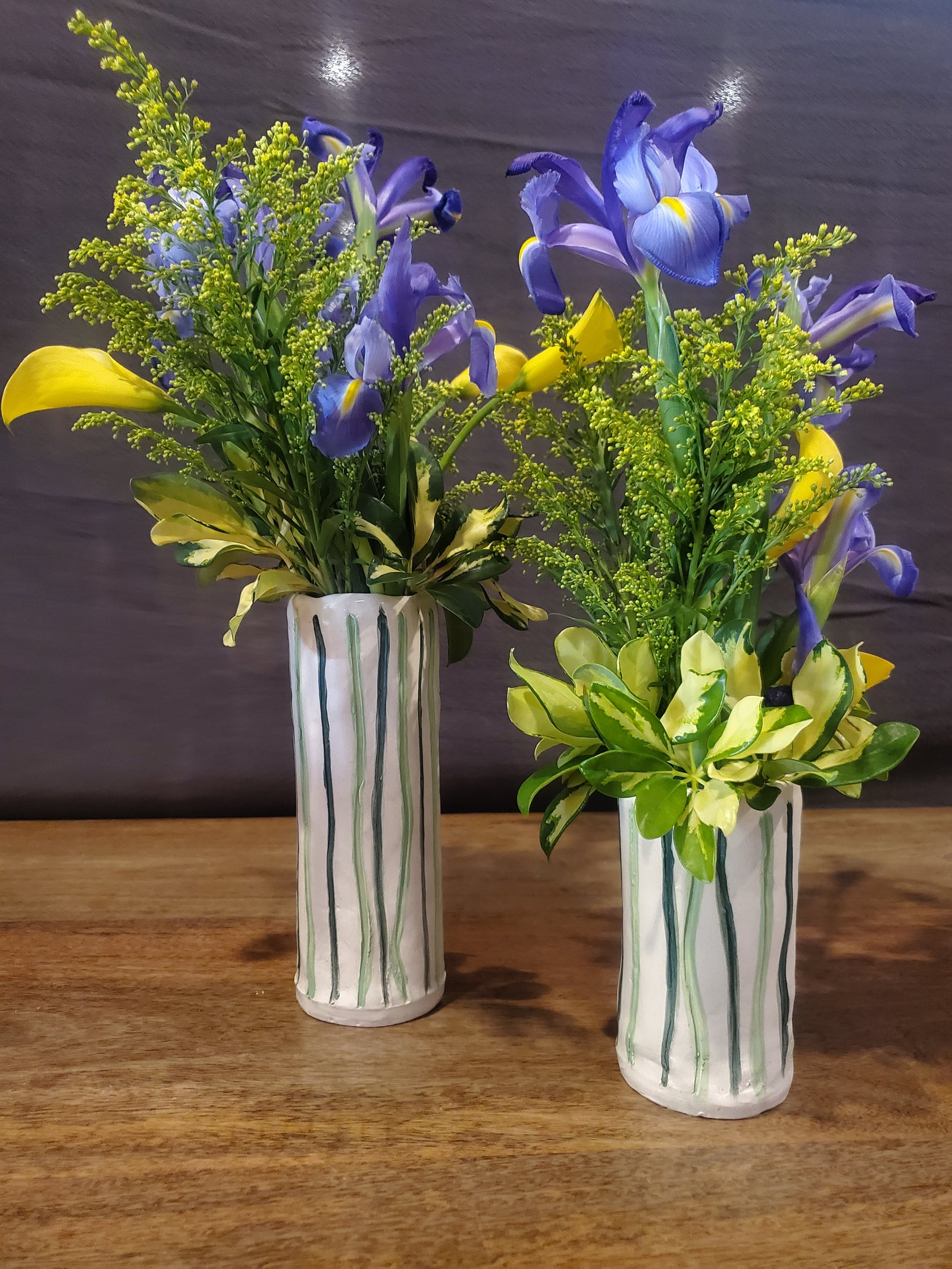 Handmade white and green vertical vases.